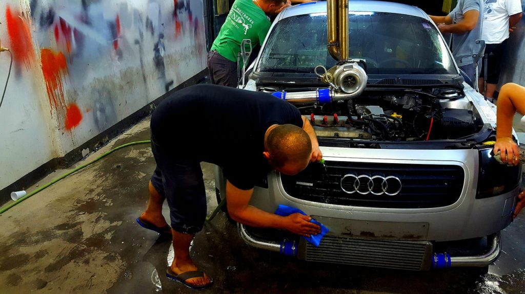 team repairing car